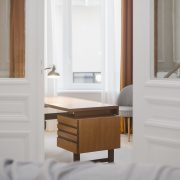 Open doors peeking at wood desk