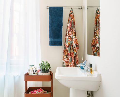 Bathroom sink with rust shelves