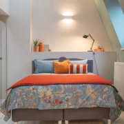 Front view of orange and blue bed