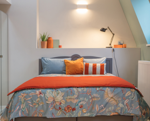 Front view of orange and blue bed