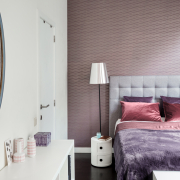 Purple wallpapered room at Morton Place with double bed 